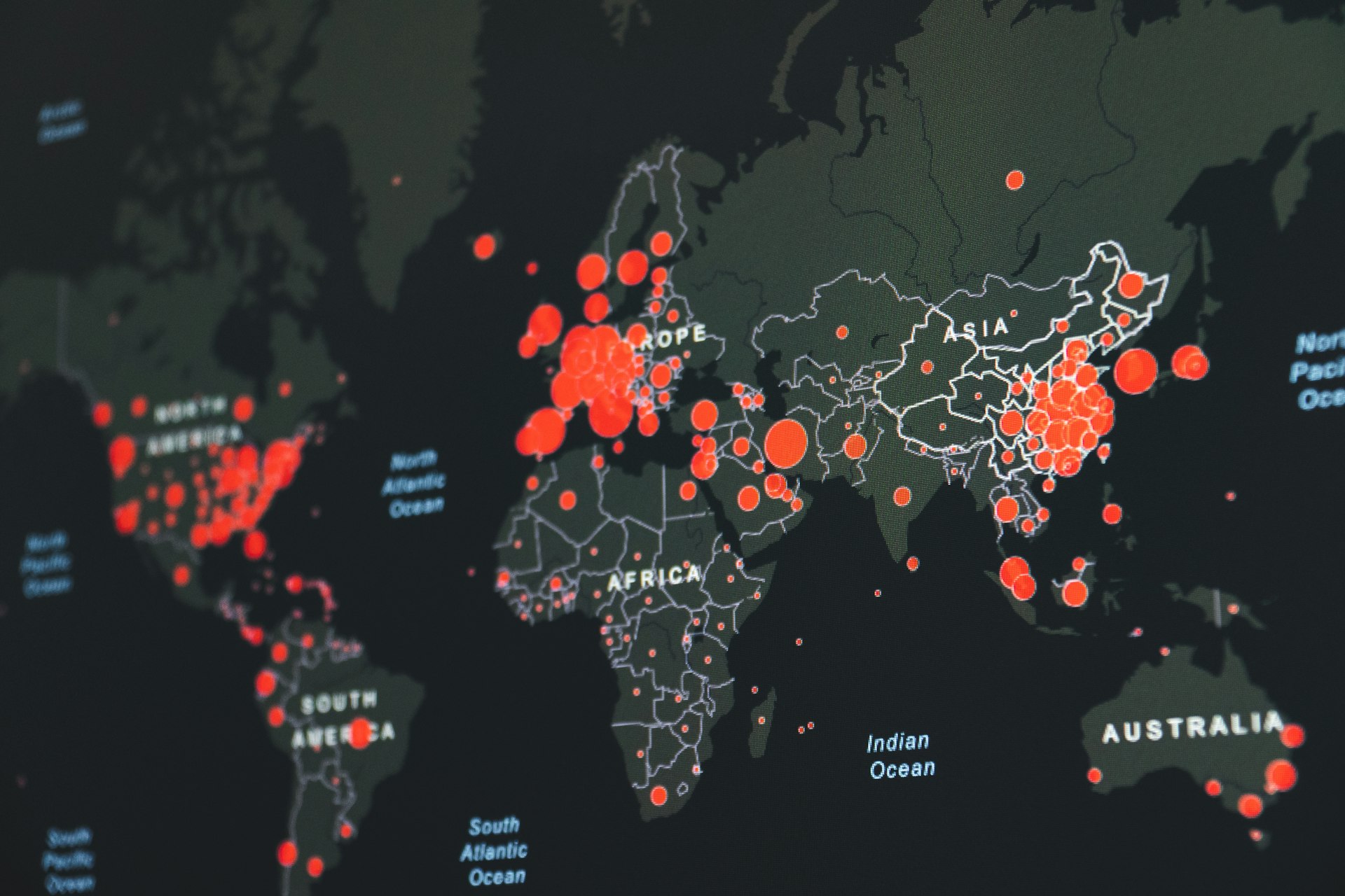 world map showing red infection clusters